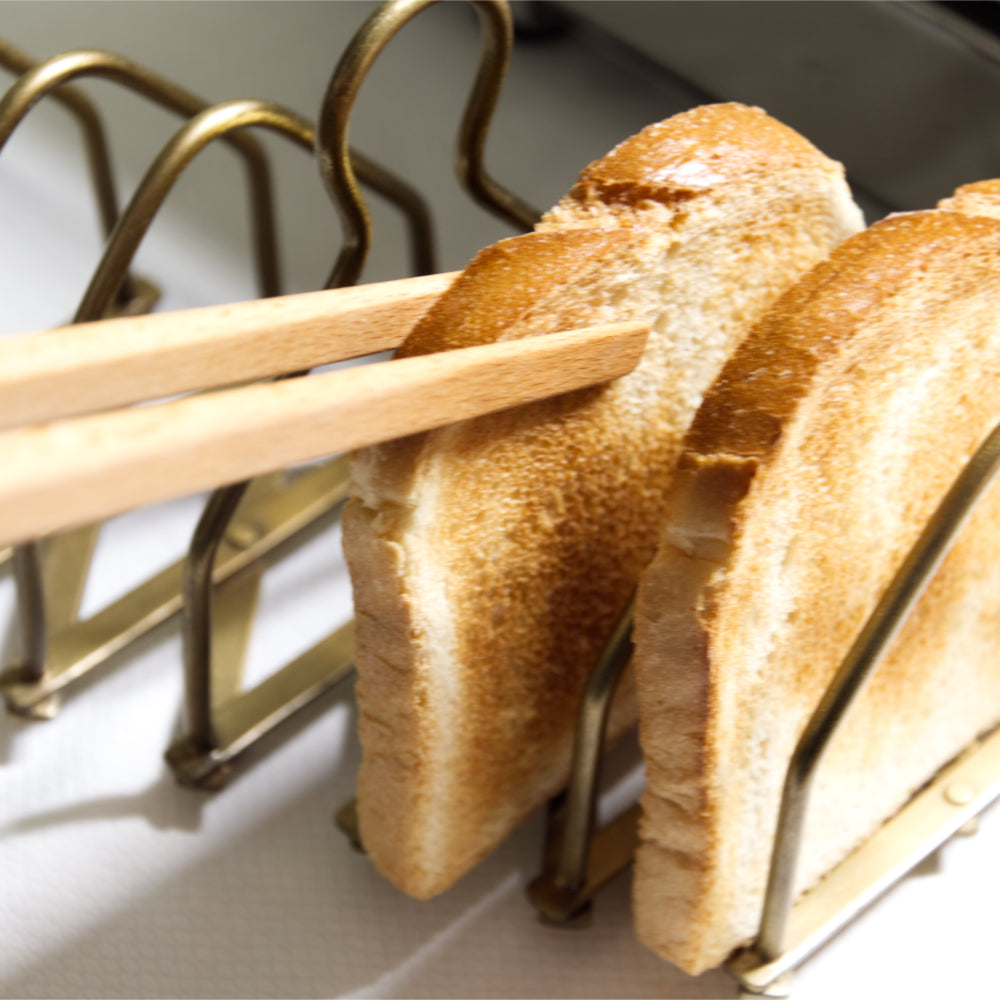 Toastzange Buchenholz mit Toastscheibe in Toastständer