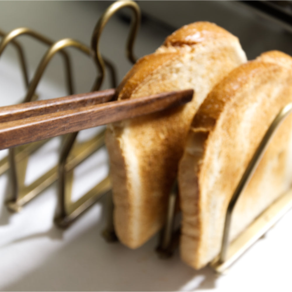 Toastzange Nussholz mit Toastscheibe in Toastständer